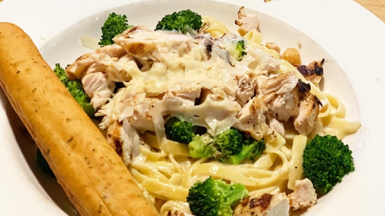 Applebee's Classic Broccoli Chicken Alfredo, served with a breadstick