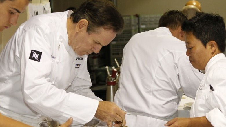 Thomas Keller inspects dish
