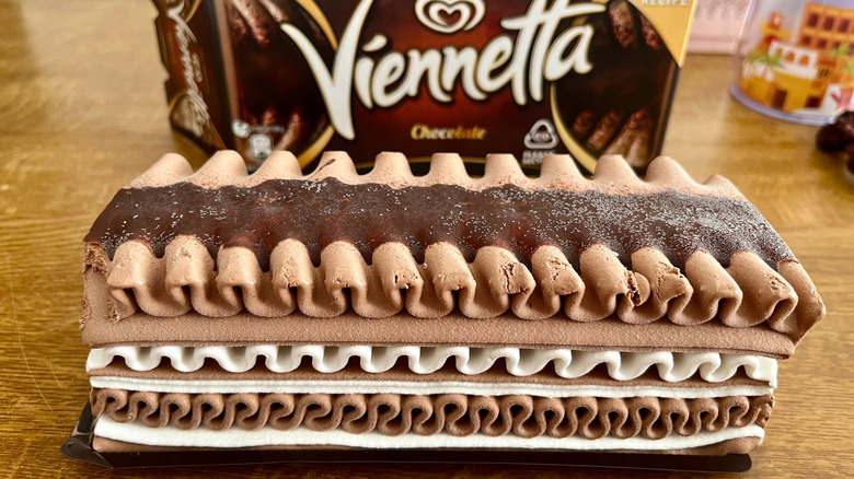 A chocolate Viennetta, with its out-of-focus box in the background