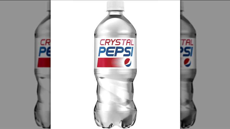 A bottle of clear Crystal Pepsi on a white background.