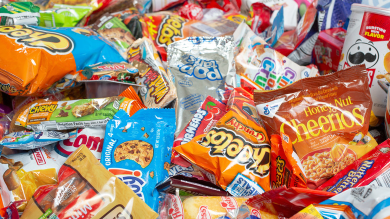 An assortment of prepackaged snacks in a pile.