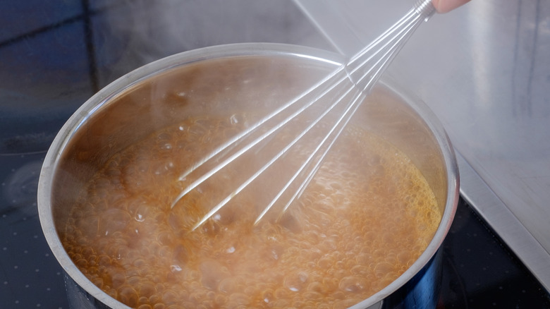Whisk stirring hot mixture
