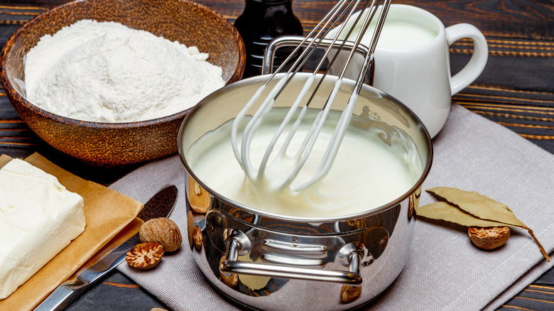 Whisk in saucepan on table