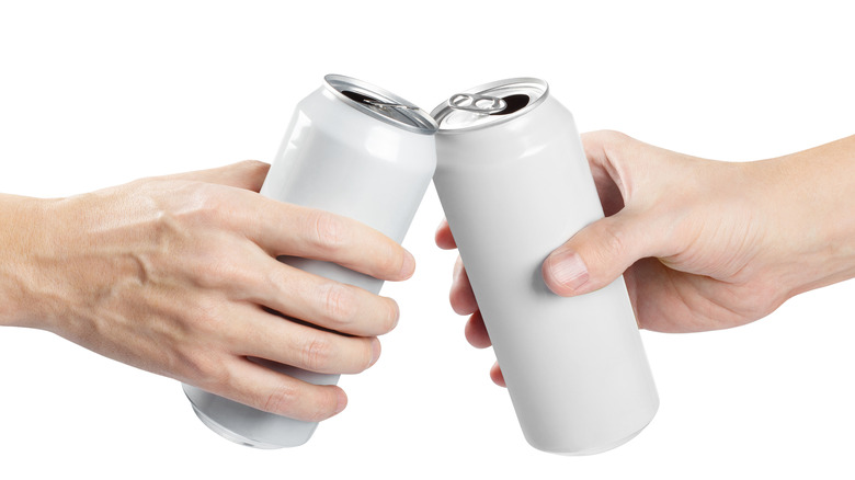 two hands clinking beers