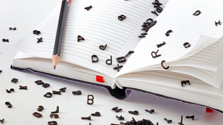 letters falling off of a page