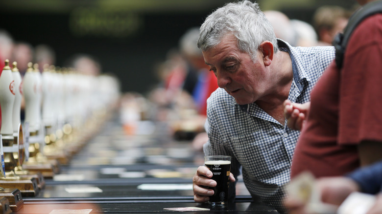 Man with glass of stout
