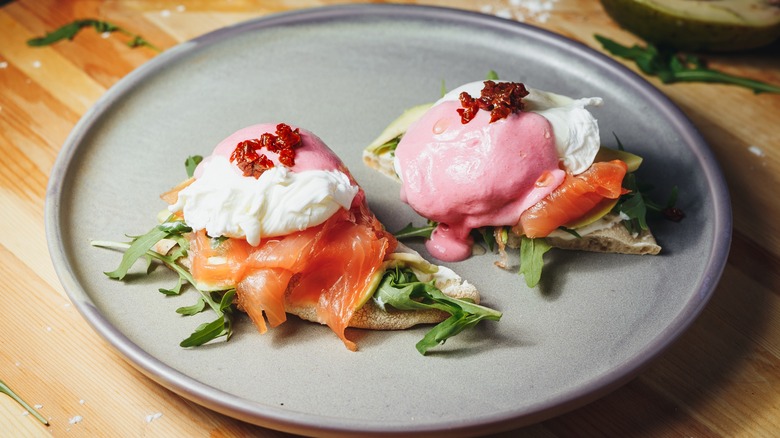 Eggs Benedict with pink hollandaise