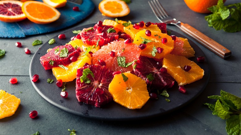 Plate of sliced citrus fruits