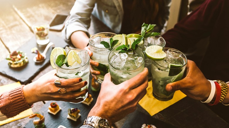 Hands holding drinks