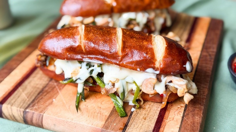 Chicken cheesesteak sandwiches on wooden board