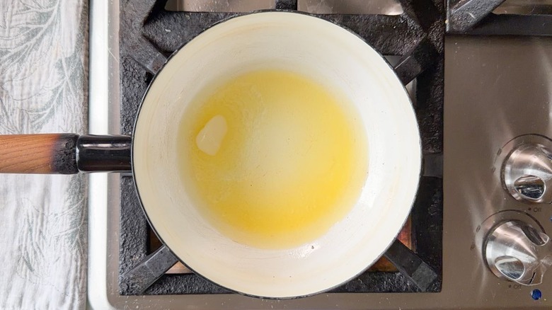 Butter melting in saucepan on stovetop