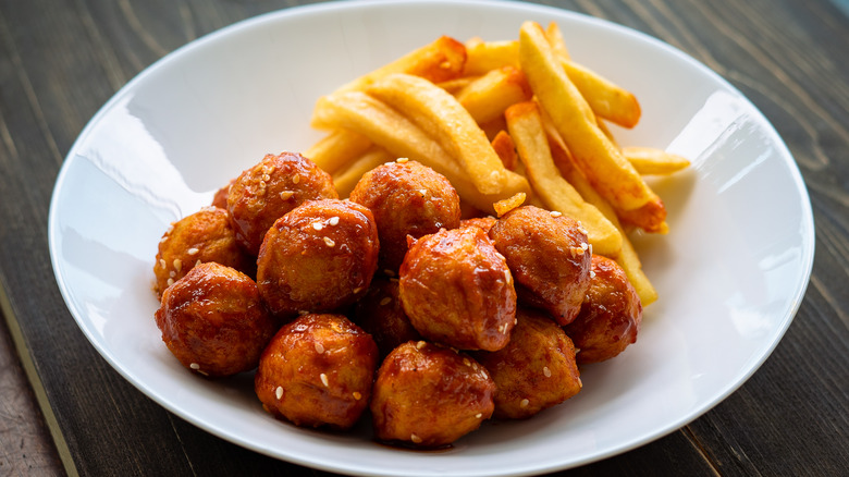 dish with meatballs and fries