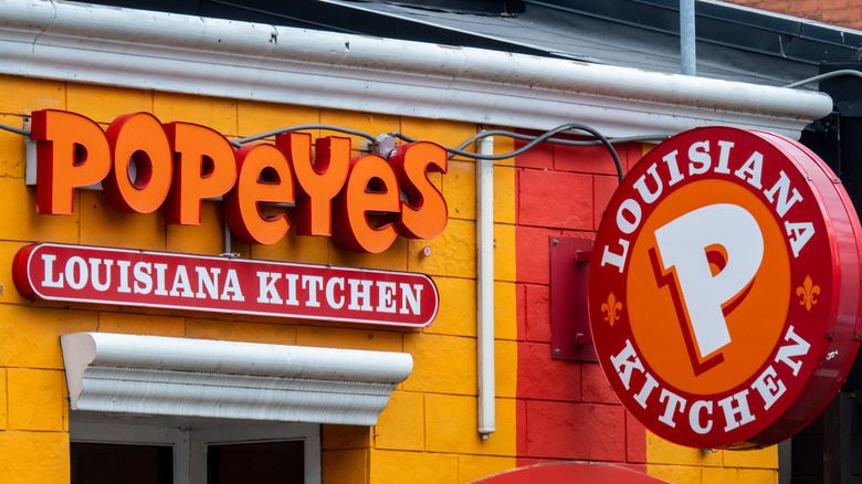Popeyes logo and restaurant