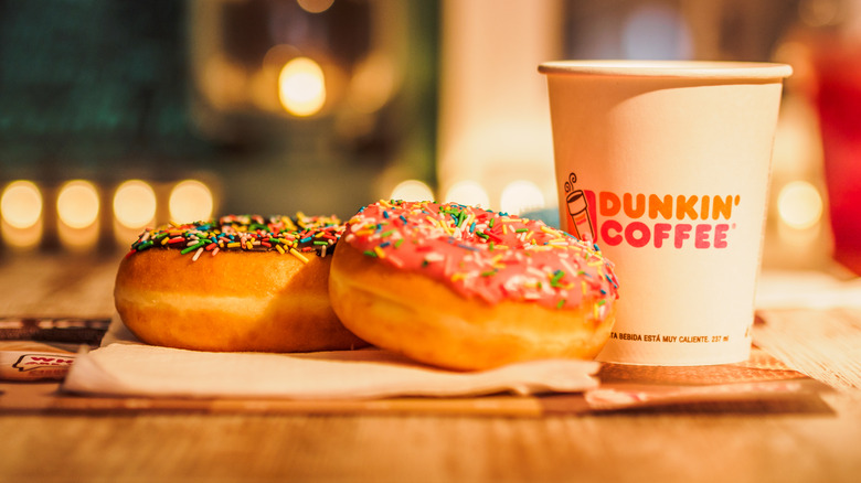 A cup of Dunkin' coffee and donuts