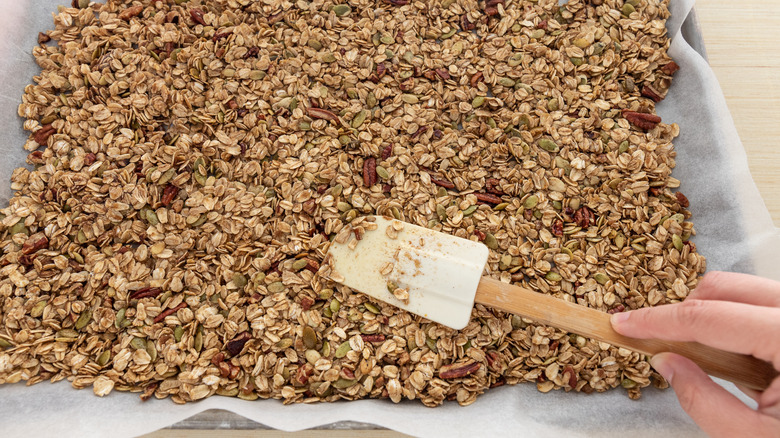 Making granola with spatula