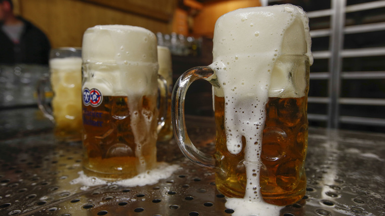 foamy beer mugs