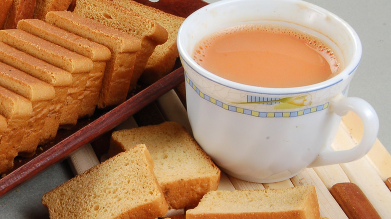 Cup of tea next to cake rusks