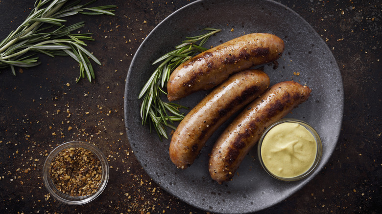 Sausages in a pan with spices