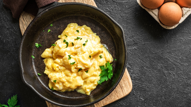 scrambled eggs in a cast iron pan