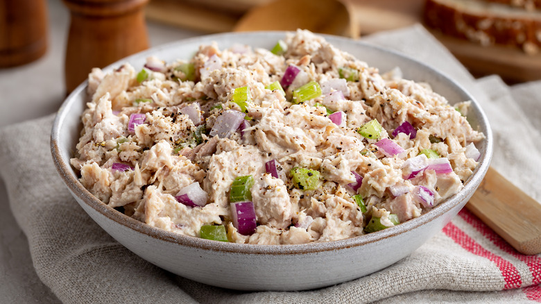 Tuna salad with chopped celery and red onion in bowl