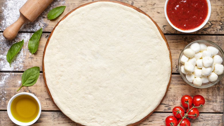 Pizza dough with ingredients