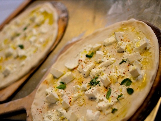 Pizza Bianca from Pizza Moto waits to go in the oven