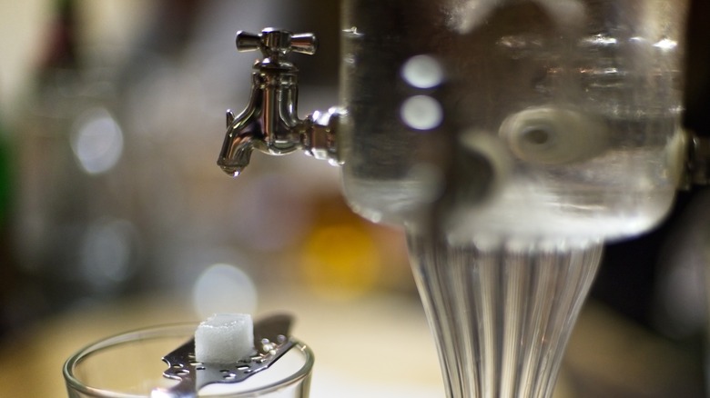 Absinthe fountain with sugar cube