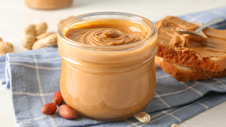 Glass jar with peanut butter 