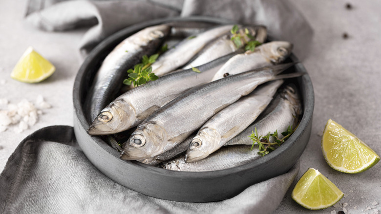 bowl of sardines with lemons