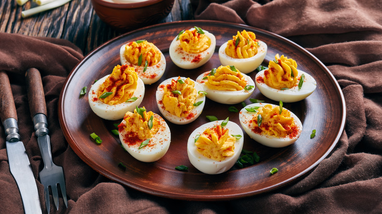 Deviled eggs on brown plate