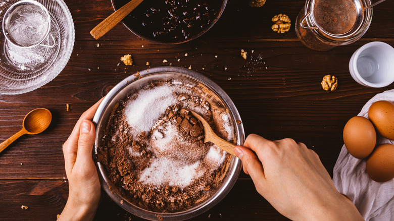 Mixing chocolate cake ingredients in a bowl
