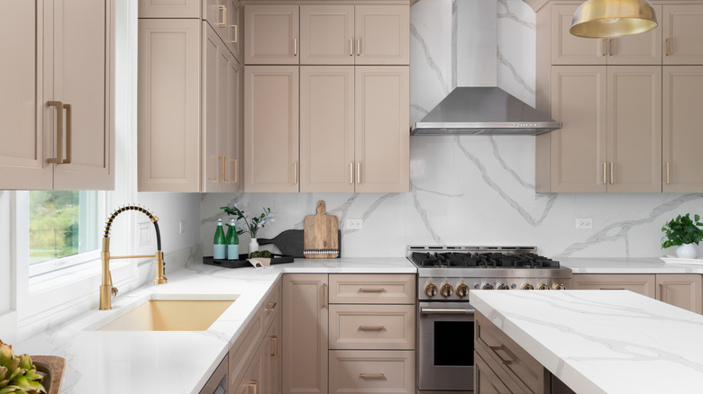 A nice and modern-looking kitchen with beige cabinets