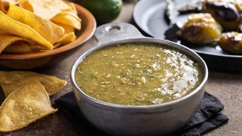 Salsa verde in bowl with chips