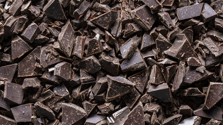 Broken chunks of dark chocolate.