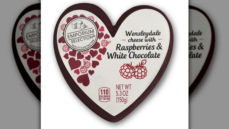 Heart-shaped package of Emporium Selection Wensleydale Cheese against white background.