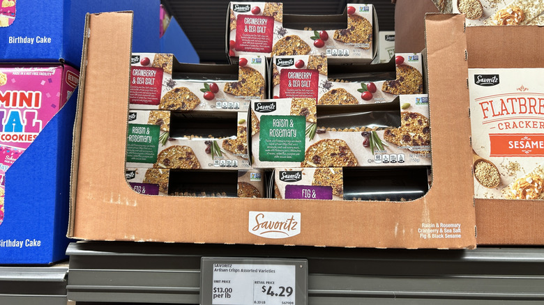 Savoritz Artisan Crisps boxes stacked in on Aldi store shelf