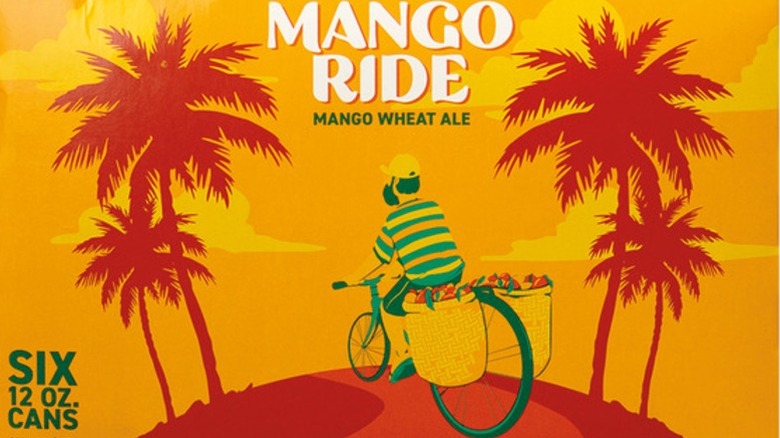 Orange packaging for Mango Ride Wheat Ale, featuring palm trees