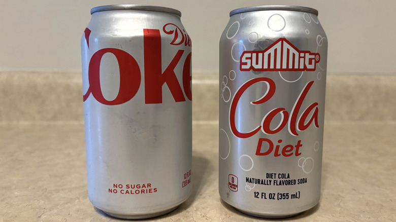 Side by side of Diet Coke and Summit Diet Cola cans