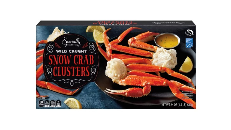 Box of Specially Selected wild-caught snow crab clusters against white background.
