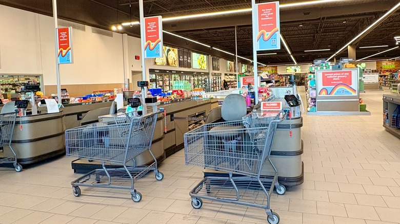 The checkout area at Aldi with empty carts waiting to be filled
