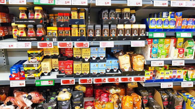 Name-brand coffee and tea products on store shelves at a Lidl in Germany