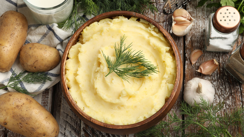 top down of mashed potatoes with dill on a table