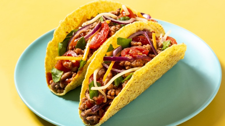 meat, cheese, and vegetable tacos
