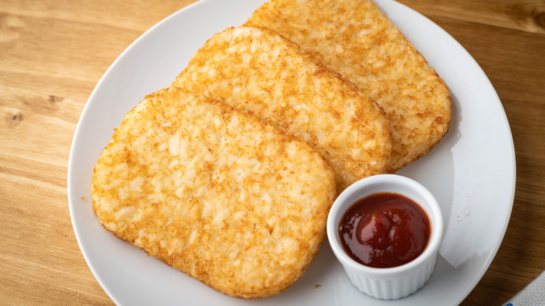 Plated hash browns with ketchup
