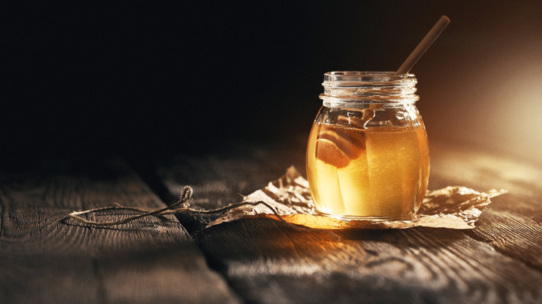 Rustic jar of clear honey
