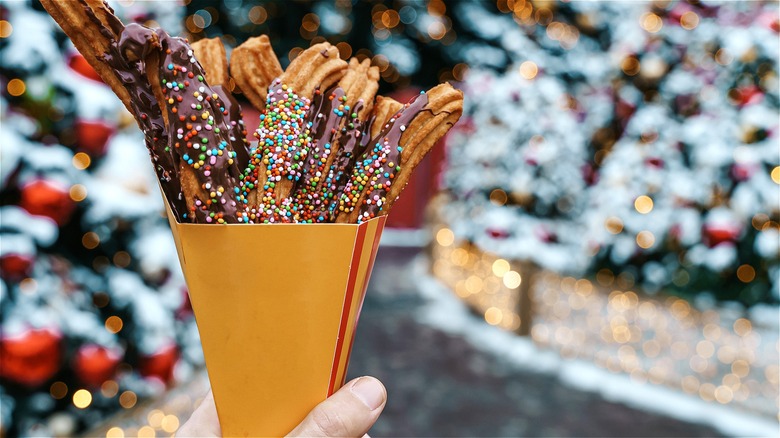 Churros with chocolate sauce and sprinkles 