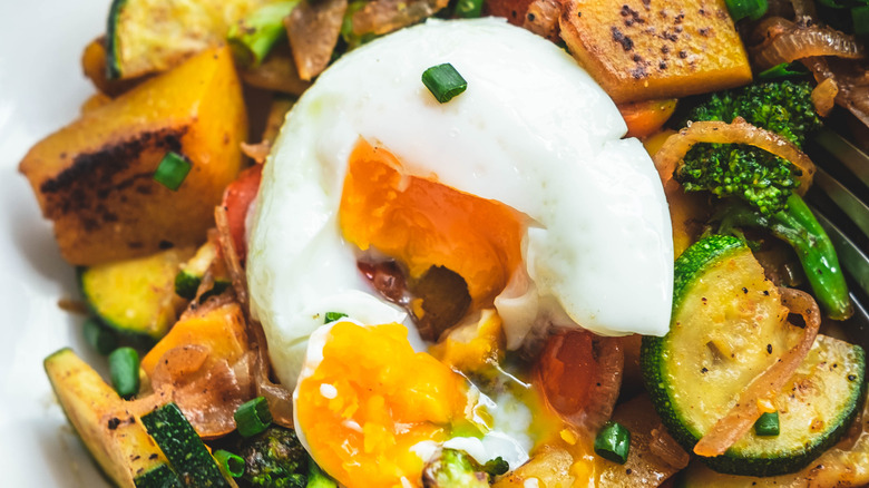 A poached egg on roasted vegetables