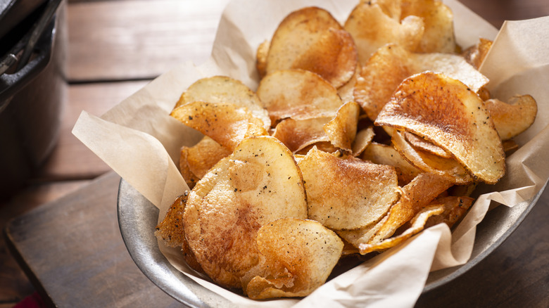 Homemade potato chips in basket