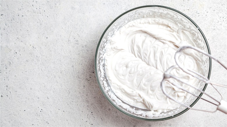 Whipped cream in clear bowl 