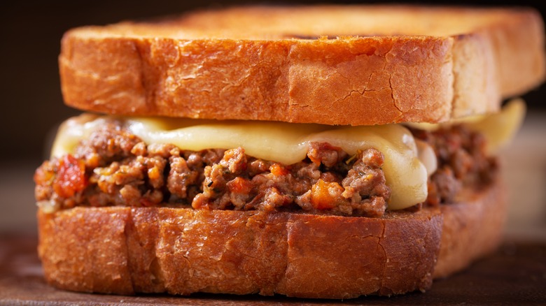 Sloppy joe on plain bread with cheese on top